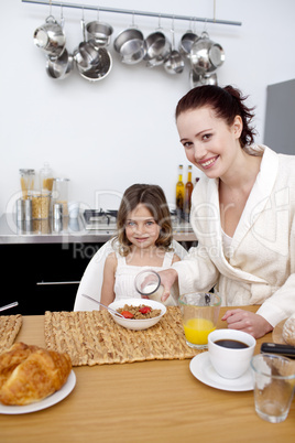 Daughter having breakfast with her mother