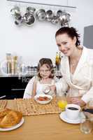 Daughter having breakfast with her mother