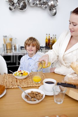 Kid having breakfast with his mother