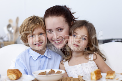 Children and mother having breakfast