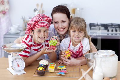 Mother baking with children in the kitchen