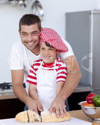 Father and son cutting bread