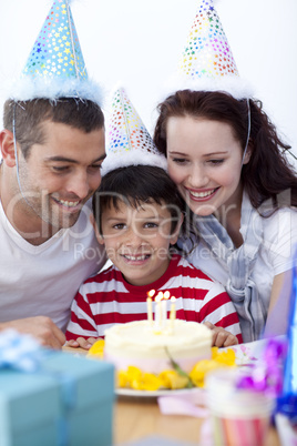 Little boy celebrating his birthday with his family