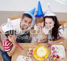 Little girl celebrating her birthday with her family