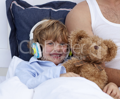 Boy listening to music in bedroom