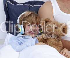 Boy listening to music in bedroom