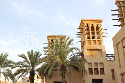 Arabic building with wind towers during sunset, Dubai, UAE