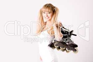 young girl with roller skates on the shoulder