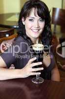 young brunette with beer glass in a restaurant