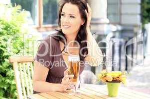 young beautiful brunette with a beer glass