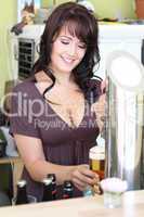 young brunette draws beer at the bar