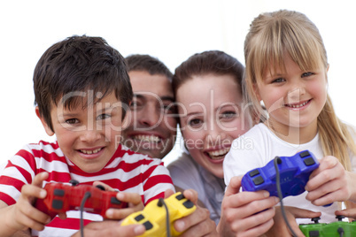 Portrait of family playing video games at home
