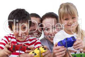 Portrait of family playing video games at home