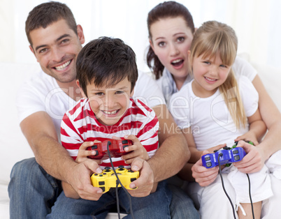 Family playing video games at home