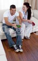 Frineds playing video games in living-room