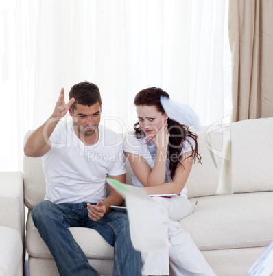 Stressed couple paying their bills