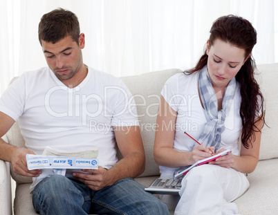 Portrait of couple doing their bills