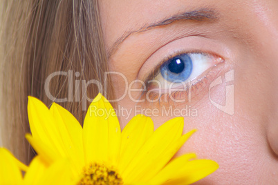 Female eye with a yellow flower