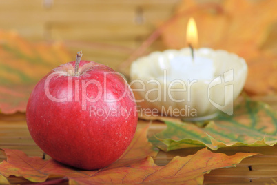 Red apple from candles on a background