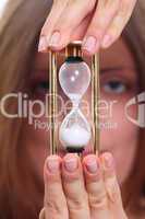 The girl with a sand clock