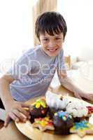 Happy boy eating colorful confectionery