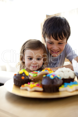 Brother and sister looking at confectionery