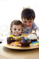 Brother and sister looking at confectionery