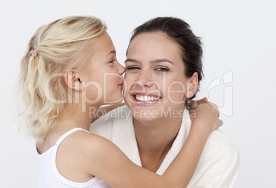 Daughter kissing her mother in bathroom