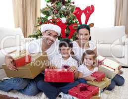Happy family celebrating Christmas at home
