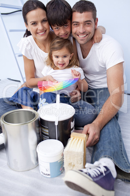 Family with colour samples to paint new house