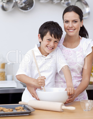 Mother and son baking in the kitchen
