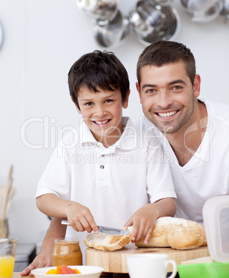 Smiling father and son preparing a toast