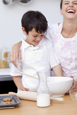 Mother and son laughing in the kitchen