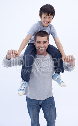 Father giving son piggyback ride