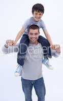 Father giving son piggyback ride