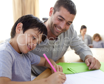 Father helping his son doing homework