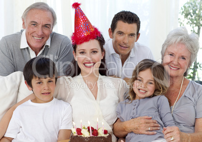 Grandparents, parents and children celebrating a birthday