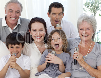 Family singing karaoke at home