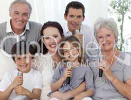 Portrait of family singing in living-room