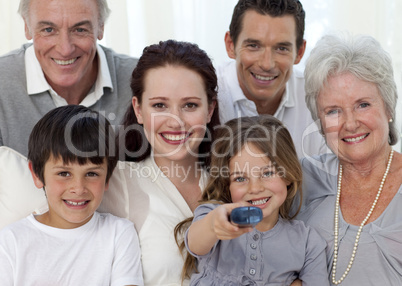 Family watching television at home