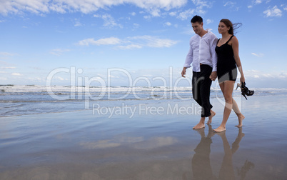 Romantic Man and Woman Couple Walking On A Beach