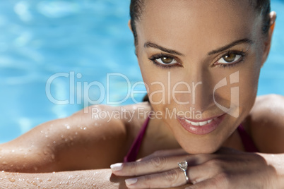 Face of a Beautiful Smiling Woman Relaxing In Swimming Pool