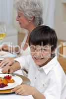 Portrait of a boy having dinner with his family