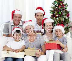 Happy family holding Christmas presents