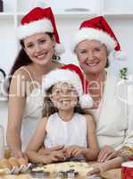 Daughter, mother and grandmother baking Christmas sweets