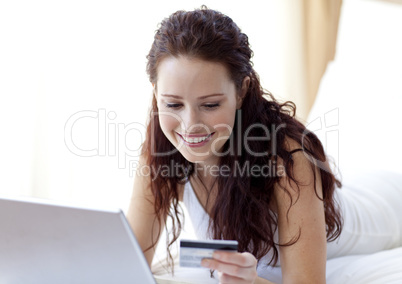 Smiling beautiful woman shopping online