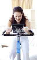 Beautiful woman doing spinning at home