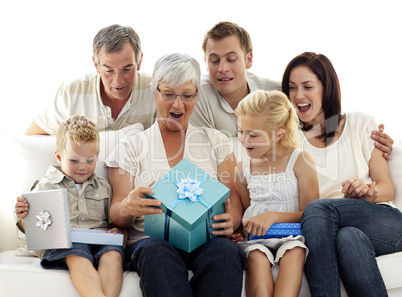 Family opening presents in grandmother's birthday