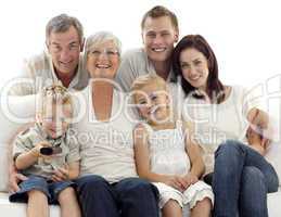 Happy family watching television in living-room