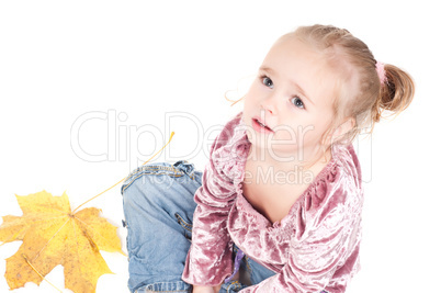 Toddler with maple leaves